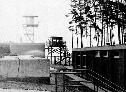 Photo: Interior of an 11th Armored Cavalry Regiment observation post, showing modern steel tower (left) built to replace the wooden watch-tower (center).
